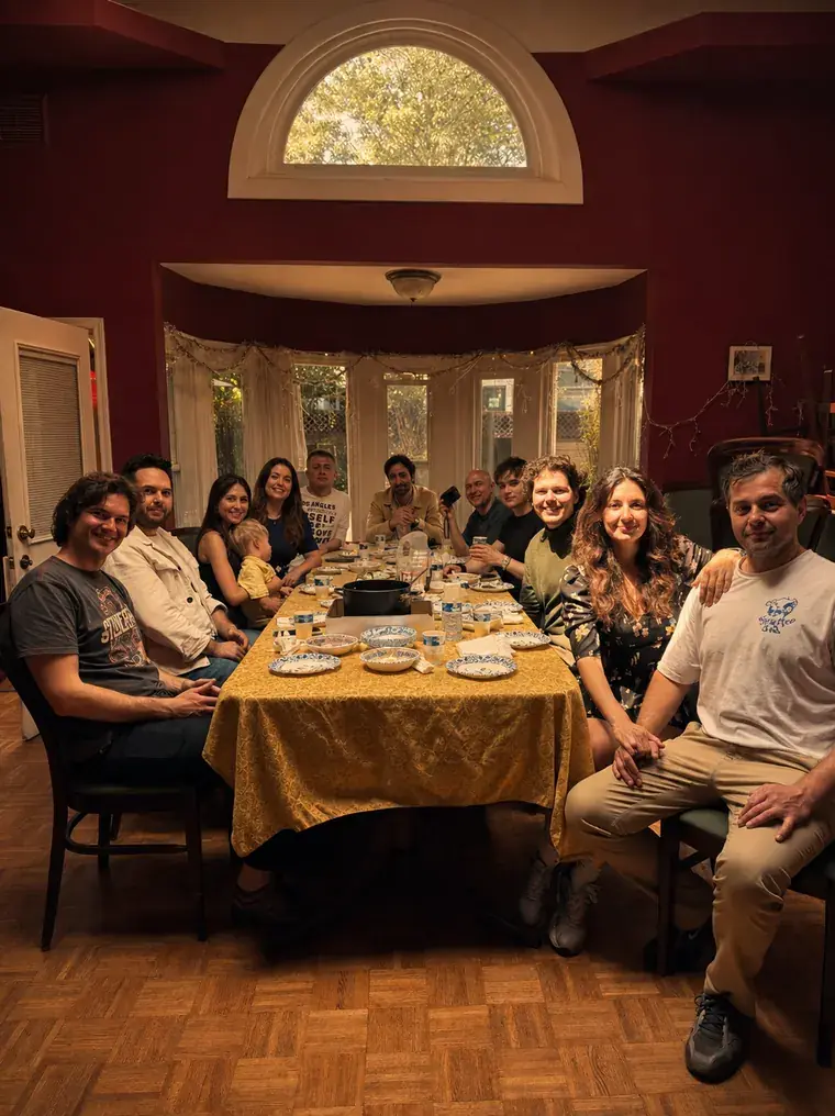 A long table of friends and family at Europa